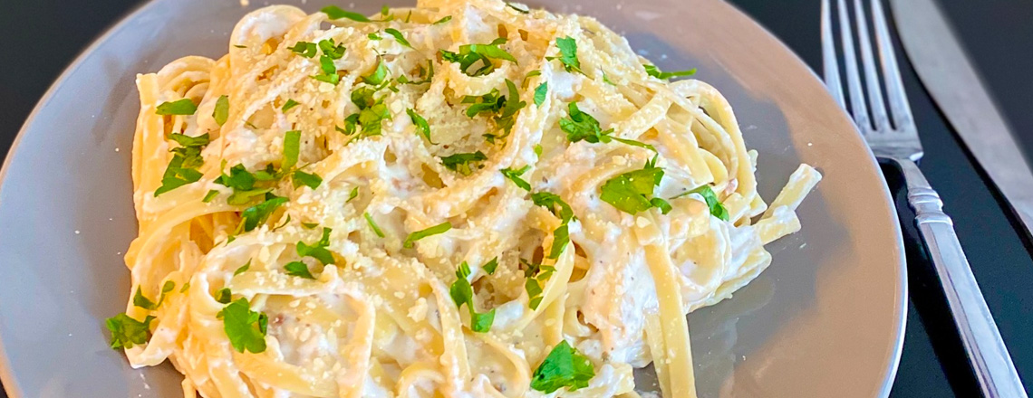 Noodles in a creamy alfredo sauce made from Westby Cooperative Creamery ingredients.
